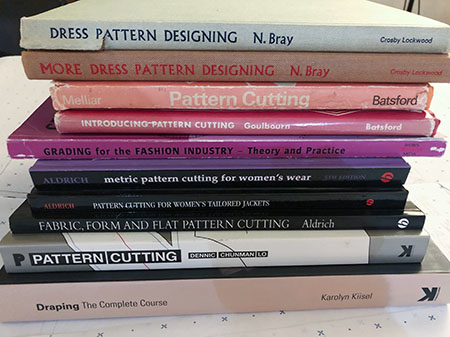 Image of a pile of pattern designing and drafting books I have bought over the years